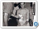 General Casey awards a purple heart to Chuck Donahoo at Long Bin hospital, 30 May 1970.  General Casey was killed a few weeks later in a helicopter crash.